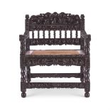Y AN INDIAN SOLID EBONY ARMCHAIR, COROMANDEL COAST, LATE 17TH CENTURY