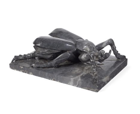 A LARGE BLACK MARBLE MODEL OF A BEETLE  ITALIAN, CIRCA 1920 approximately 18.5cm high, base 37 by 51.5cm  