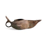AN ISLAMIC BRONZE OIL LAMP, POSSIBLY 9TH CENTURY