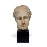 A MARBLE HEAD OF A GODDESS, ROMAN, 18TH CENTURY OR EARLIER