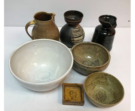 A collection of studio pottery to include Marion de Trey (1913-2016) jug with sgraffito style feathered decorated band to mid