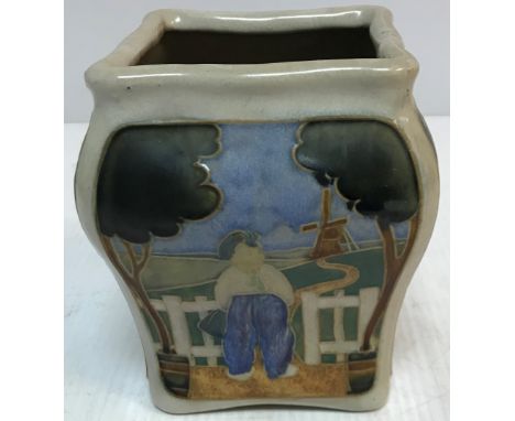 A Royal Doulton Lambeth square form vase decorated with Dutch figures in landscapes, No'd “H39” to base and bearing monogram 