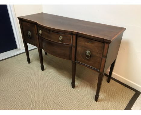 A 19th Century mahogany and inlaid bow fronted sideboard, the two central drawers flanked by a cupboard and deep drawer with 