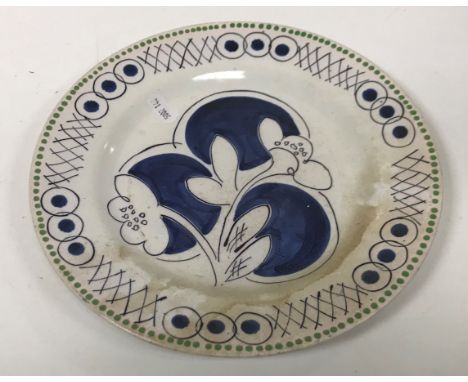 A Clarice Cliff “Bizarre” plate with floral spray decoration, designed by Vanessa Bell for the 1934 Harrods and Art in Indust