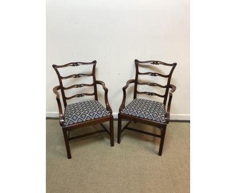 A set of eight late 20th Century (1995) mahogany framed dining chairs in the Chippendale style with carved open ladder backs 