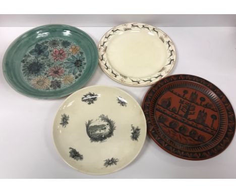 A collection of four early 20th Century plates comprising a Spode Royal Jasmine reindeer design plate by J Hassall 25 cm in d