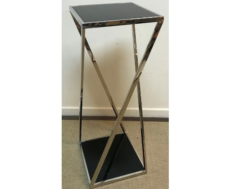 A modern chrome framed and black glass panelled two tier lamp table or plant stand, 40.5 cm x 40.5 cm x 110.5 cm high, togeth