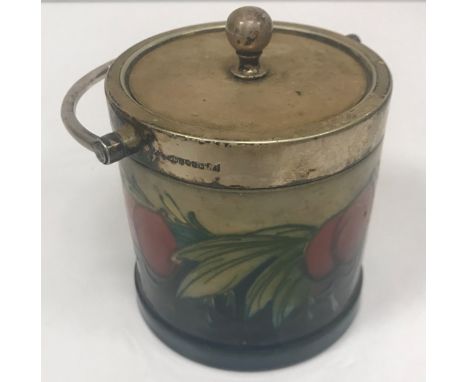 A Moorcroft wisteria plum pattern preserve pot with plated mounts, bears impressed Moorcroft mark and No'd M162 to base 9.5 c