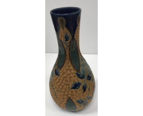 A Doulton Lambeth stoneware vase, the gilt ground set with incised swirling decoration and flower and foliate decoration by E