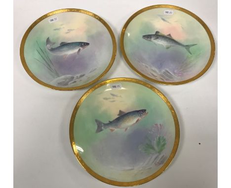 A set of three Minton fish decorated plates manufactured for Chicago Spalding &amp; Co., signed by AH Wright “Salmon”, “Pin F