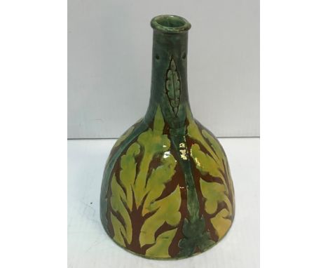 A Della Robbia Birkenhead Pottery vase of mallet form by Charles Collis decorated with stylised leaf motifs by Annie Jones be