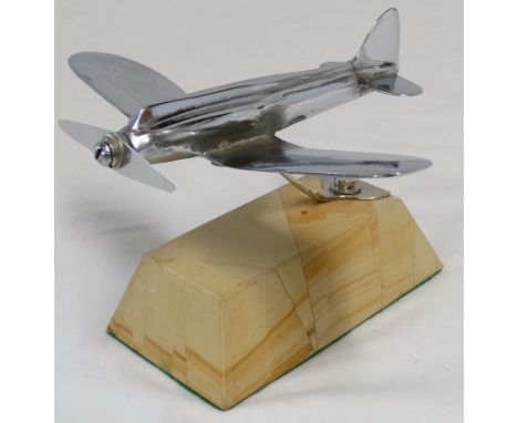 Plated model aircraft on marble base 