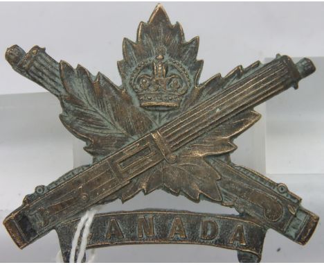WWI Canadian Machine Gun Corps cap badge. P&amp;P Group 1 (£14+VAT for the first lot and £1+VAT for subsequent lots) 