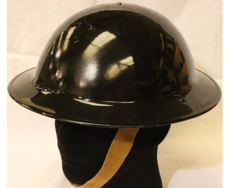 British WWII Home Front ARP wardens or Police Service helmet in black, with leather liner and one canvas chin strap. P&amp;P 