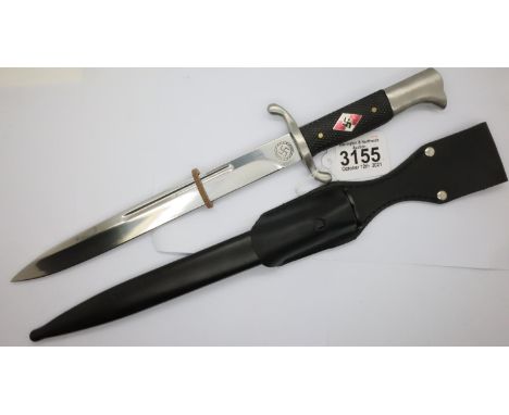 German Hitler Youth reproduction bayonet with enamelled emblem set into the chequered grip, steel scabbard and leather frog. 