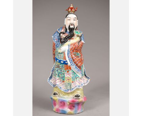 Chinese porcelain figure, of a standing noble man on integrated base, in traditional dress, with seal; painted in multicolour