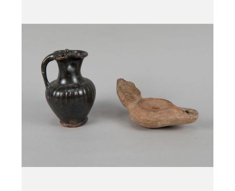 Two ancient ceramics, oil lamp in classical form handgrip in shape of leave and oinochoe black glazed greek 3.-2. Century BC,
