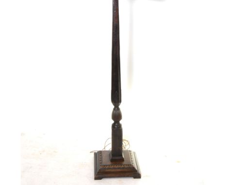 Oak standard lamp, carved column, square base, with shade.