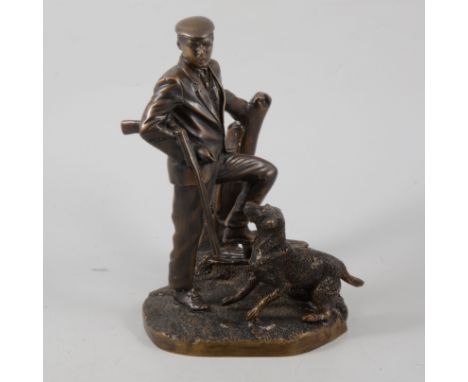 A contemporary bronze finish model of a country gent with gun and dog, height 26cm.