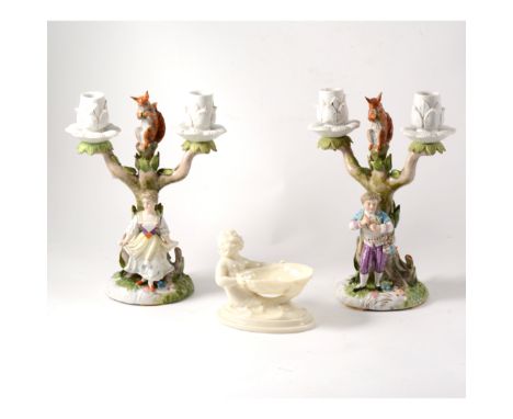 A collection of continental and Staffordshire ceramics, a pair of two light candelabra with a figure of a maiden and young ma