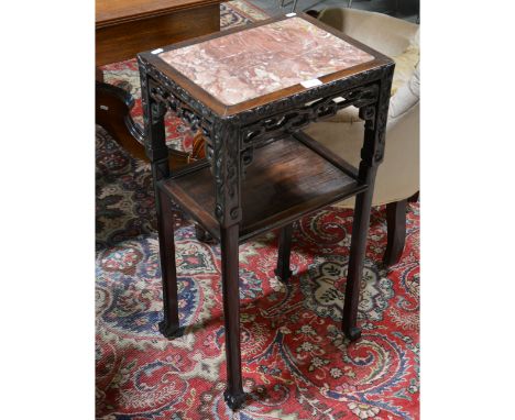 Chinese hardwood stand, rectangular marble top, the legs joined by a shelf, 42cm x 32cm, height 81cm.