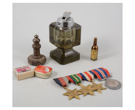 Collectibles and curios, including gramophone needles, glass table lighter, small selection of loose coins, World War Two med