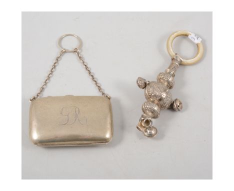 Small silver ladies purse, engraved on a silver chain; and silver mother of pearl babies rattle.