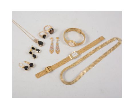 A collection of silver-gilt jewellery, a flexible necklace, pendants and chains, smoky quartz rings, a lady's Rotary wrist wa