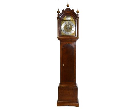 Oak longcase clock, arched hood with a shaped pediment, gold painted finials, cavetto moulded cornice, the hood with turned c