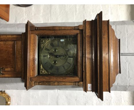 Oak longcase clock, cavetto cornice, below a pediment, plain frieze, the hood with three-quarter columns, long door with cros