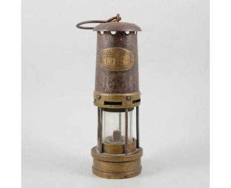 A 19th Century brass miners lamp, by E. Thomas and Williams of Aberdare, 28cm.