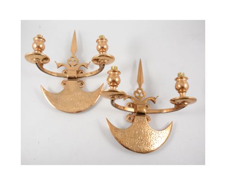 Five brass wall lights, twin light designed with axe heads, 31cm.