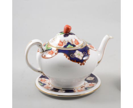 Tuscan China Imari style tea service, comprising twelve tea plates, teacups, saucers, a teapot, teapot stand, and sugar basin