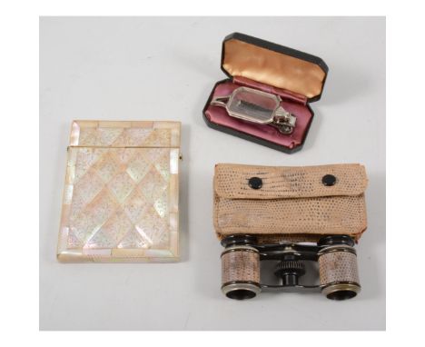 Mother of pearl card case, lorgnettes, in leather case and a pair of opera glasses, in snake skin type case. (3)