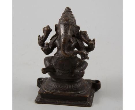 South East Asian bronze effect figure of Ganesha, 14cm.