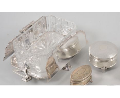 Silver covered teapot stand, hallmarked Birmingham 1932, a glass sardine dish with silver-plated mounts and stand, two silver