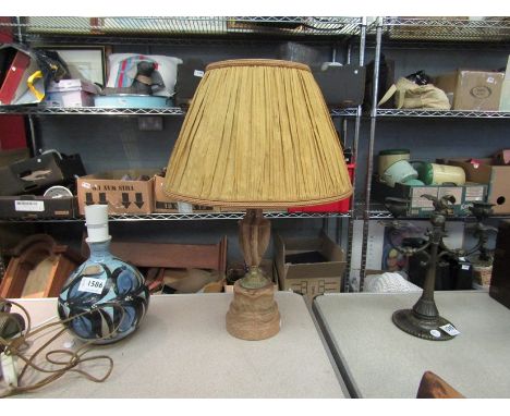 An onyx table lamp with pleated shade