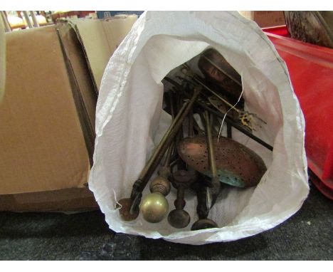 A bag containing fire tools and copper wares