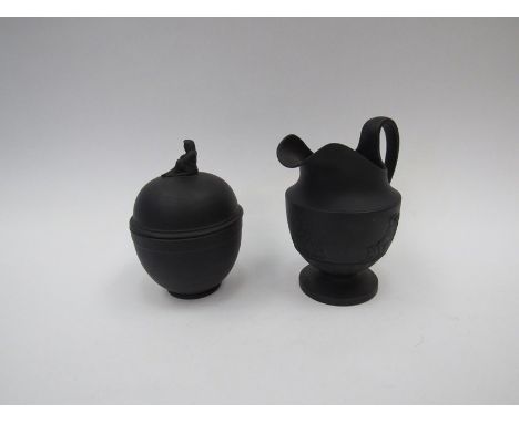 A 19th Century Wedgwood black basalt milk jug and a similar lidded sucrier (2)