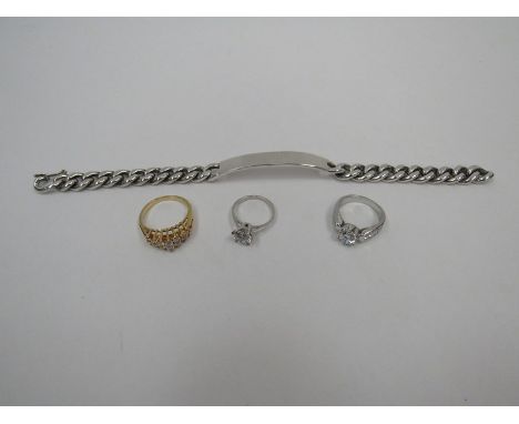 A white metal gent's bracelet, a gold plated ring and two rings marked 925 (4)