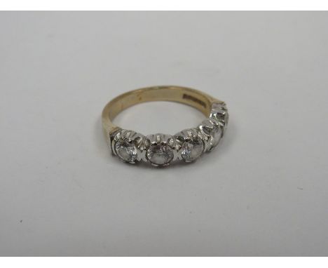 A 9ct gold ring set with five clear stones, size P. 4g