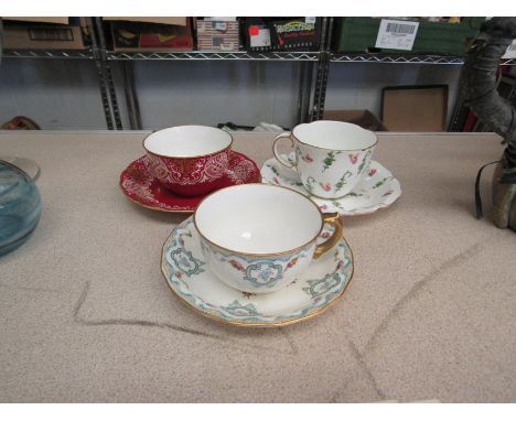 Three variously patterned Royal Crown Derby porcelain tea cups and saucers (6)