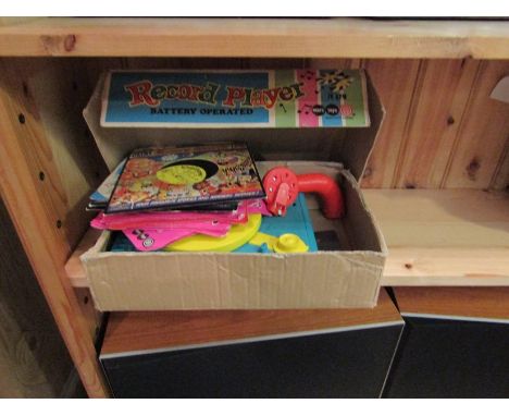 A retro children's record player, boxed