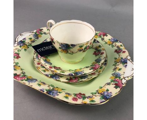 AYNSLEY PART TEA SERVICE, with floral decoration on a green ground, comprising seven cups, eight saucers, twelve side plates 
