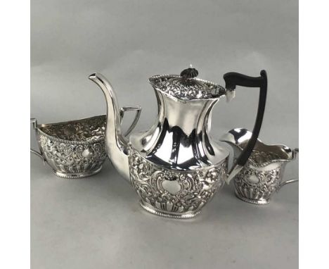 THREE PIECE SILVER PLATED OVAL SHAPED TEA SERVICE, embossed with cherubs and scrolling foliage (3)