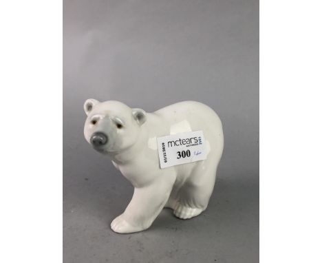 LLADRO FIGURE OF A POLAR BEAR, 10cm high, along with three Nao figures of swans (4)