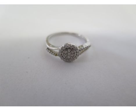 A silver diamond ring .25ct with report - size N/O approx 1.9 grams, in good condition 