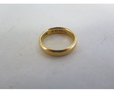 A 22ct yellow gold band ring, size J/K, approx 5.8 grams 