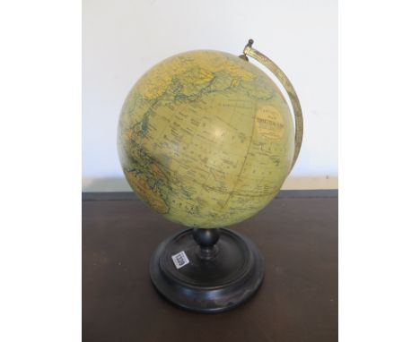 A vintage Phillips 9 inch Terrestrial Globe with ebonised stand, approximately 34cm high overall, globe with some foxing, bas