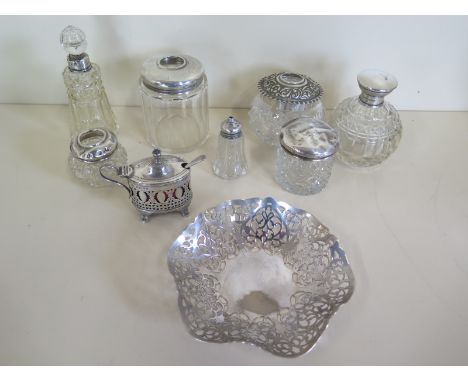 A selection of silver items, a pierced decorative silver bon bon dish, a condiment pot with associated spoon also seven silve